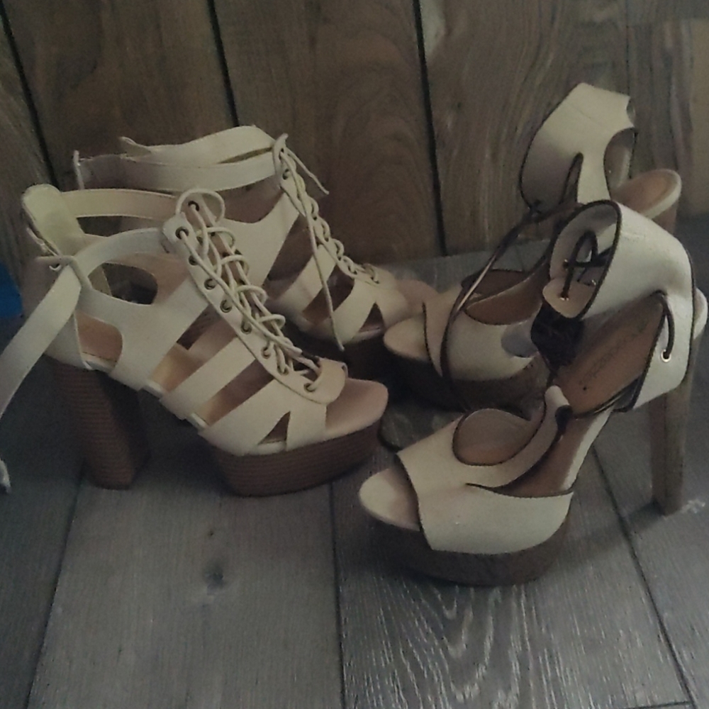 2 pair of Tan heels size 8.